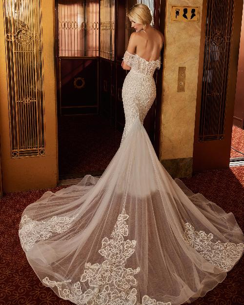122109 fitted sparkly wedding dress with sleeves and plunging neckline1